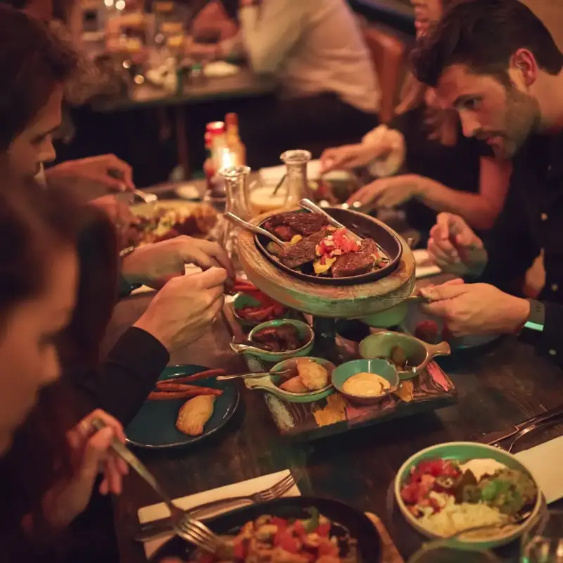 Friends sharing a Latin American feast